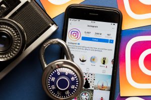 Instagram data security concept. Instagram logos printed onto paper with a combination padlock